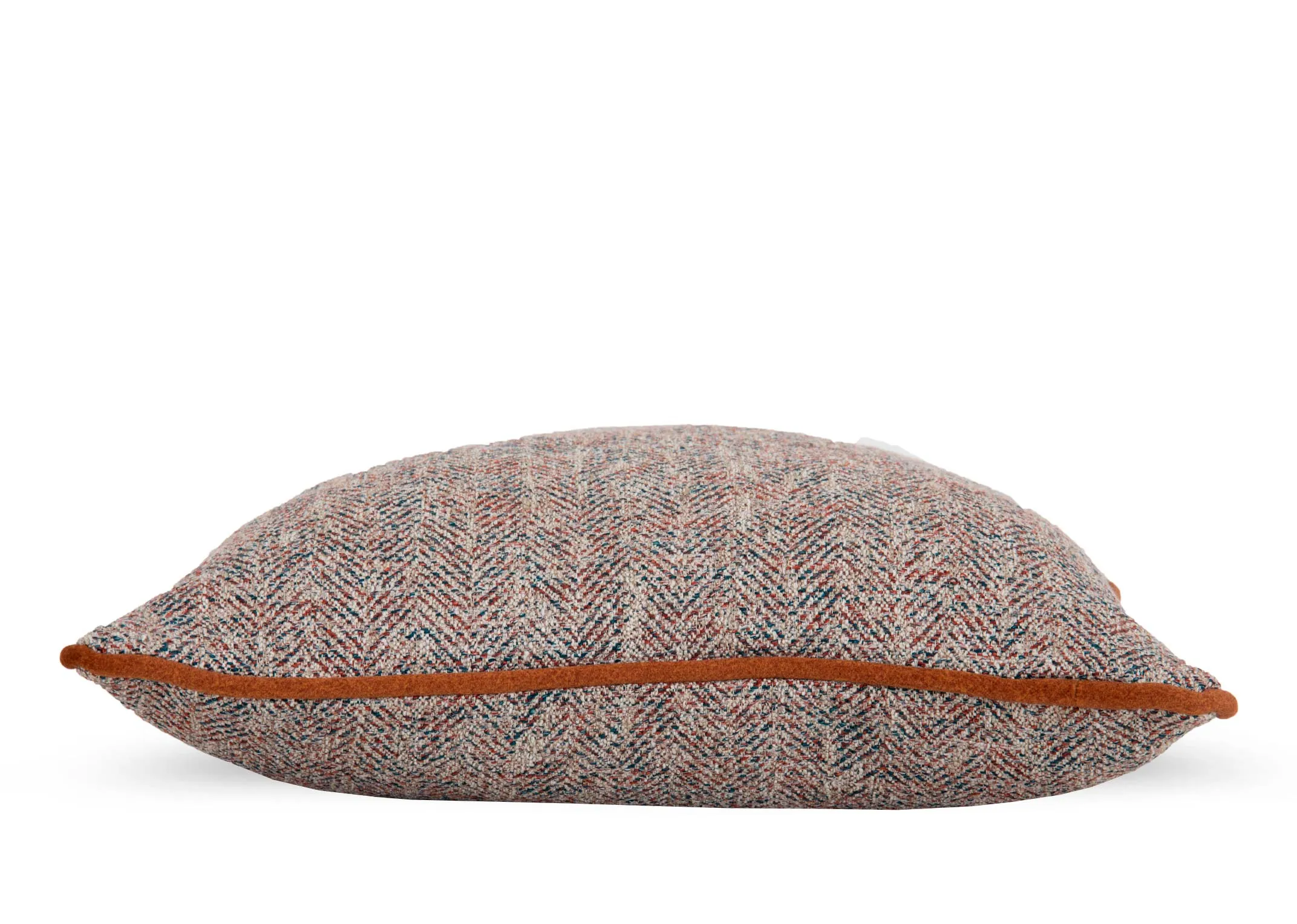 A copper velvet trim on an accent fabric cushion from EZ Livings Strandhill range. Side view of copper velvet piping.