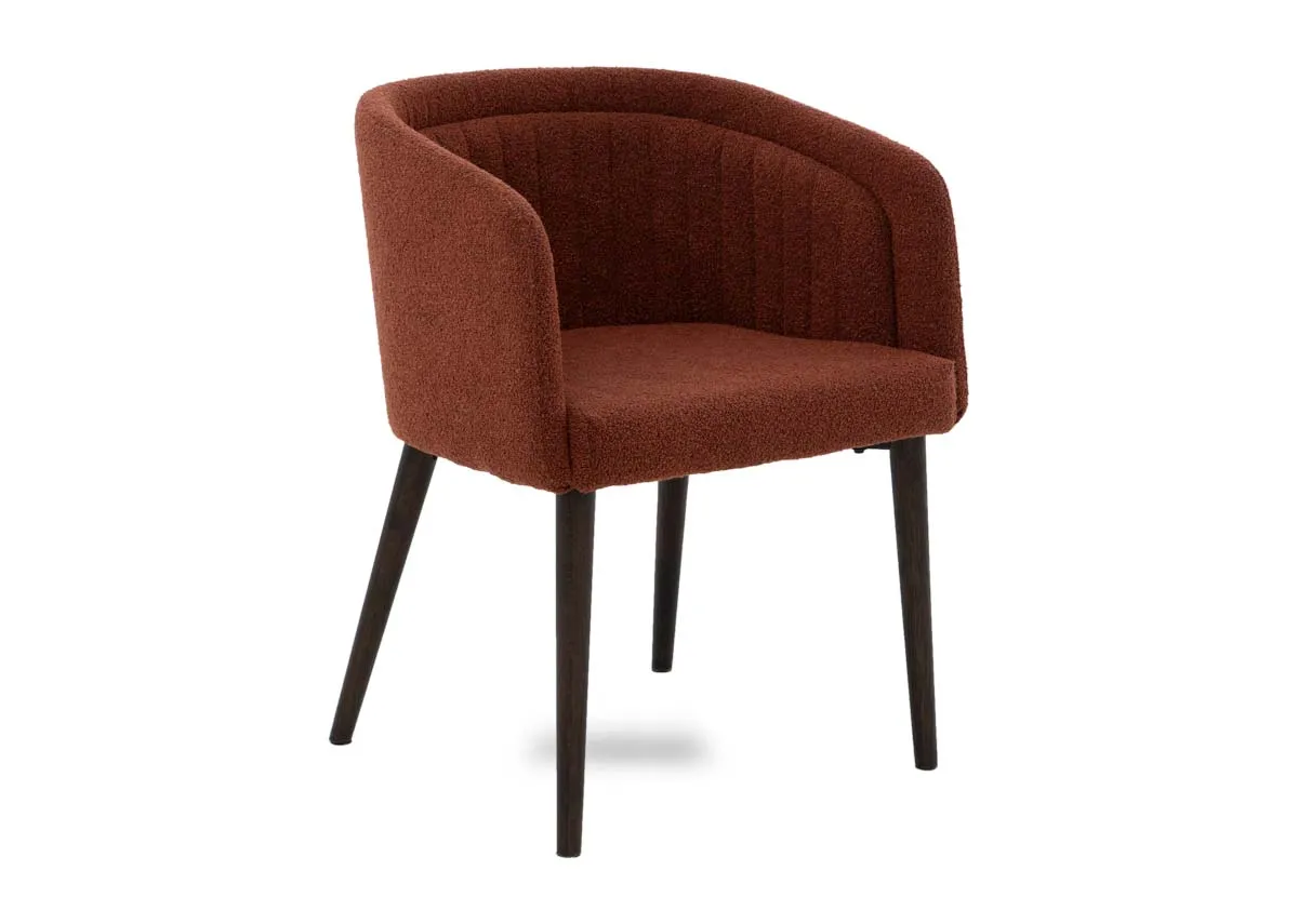 A curved orange dining chair from EZ Livings Bardot range. Angled view.