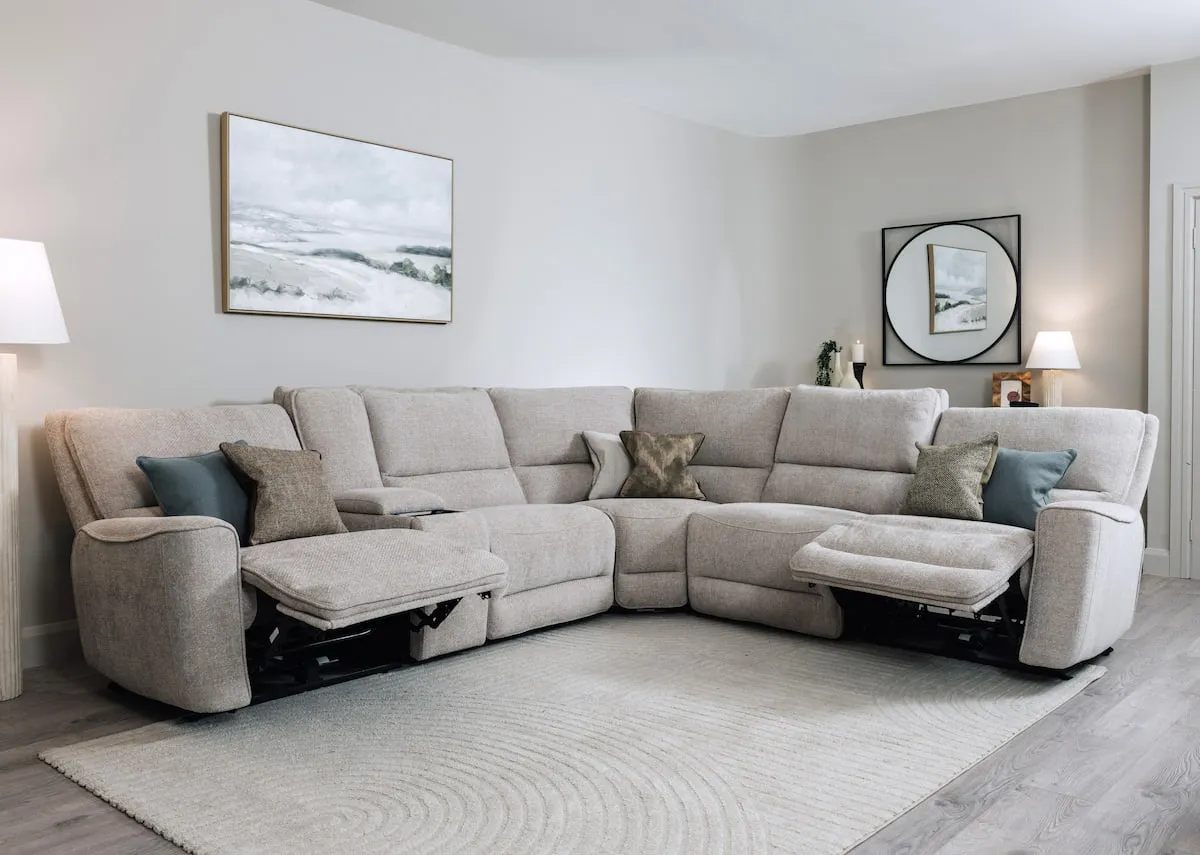 A lifetsyle image of the Ashbrook sofa with the Elio rug and Edith lamps