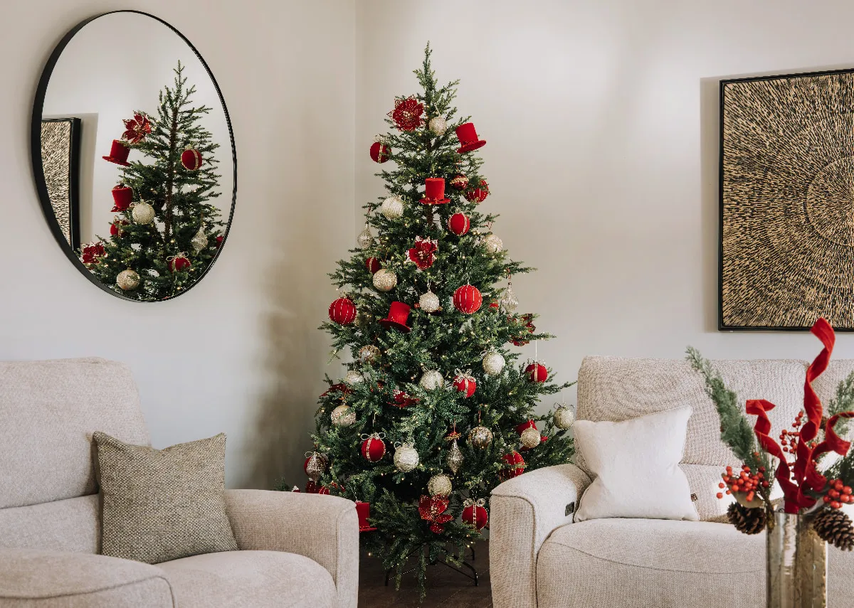 A lifestyle image of the Douglas LED tree with red & gold color scheme