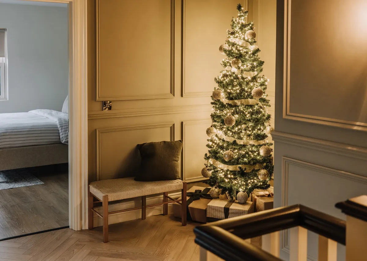 A lifestyle image of the Galaxy lights on the Noble Christmas tree.