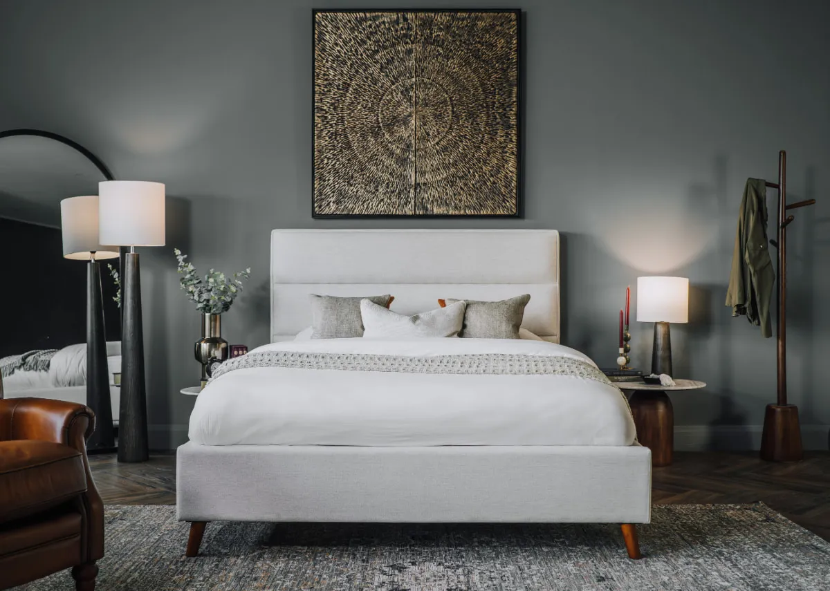 A lifestyle image of the Ebony bedframe with Dara canvas and Melody lamps with slade side tables