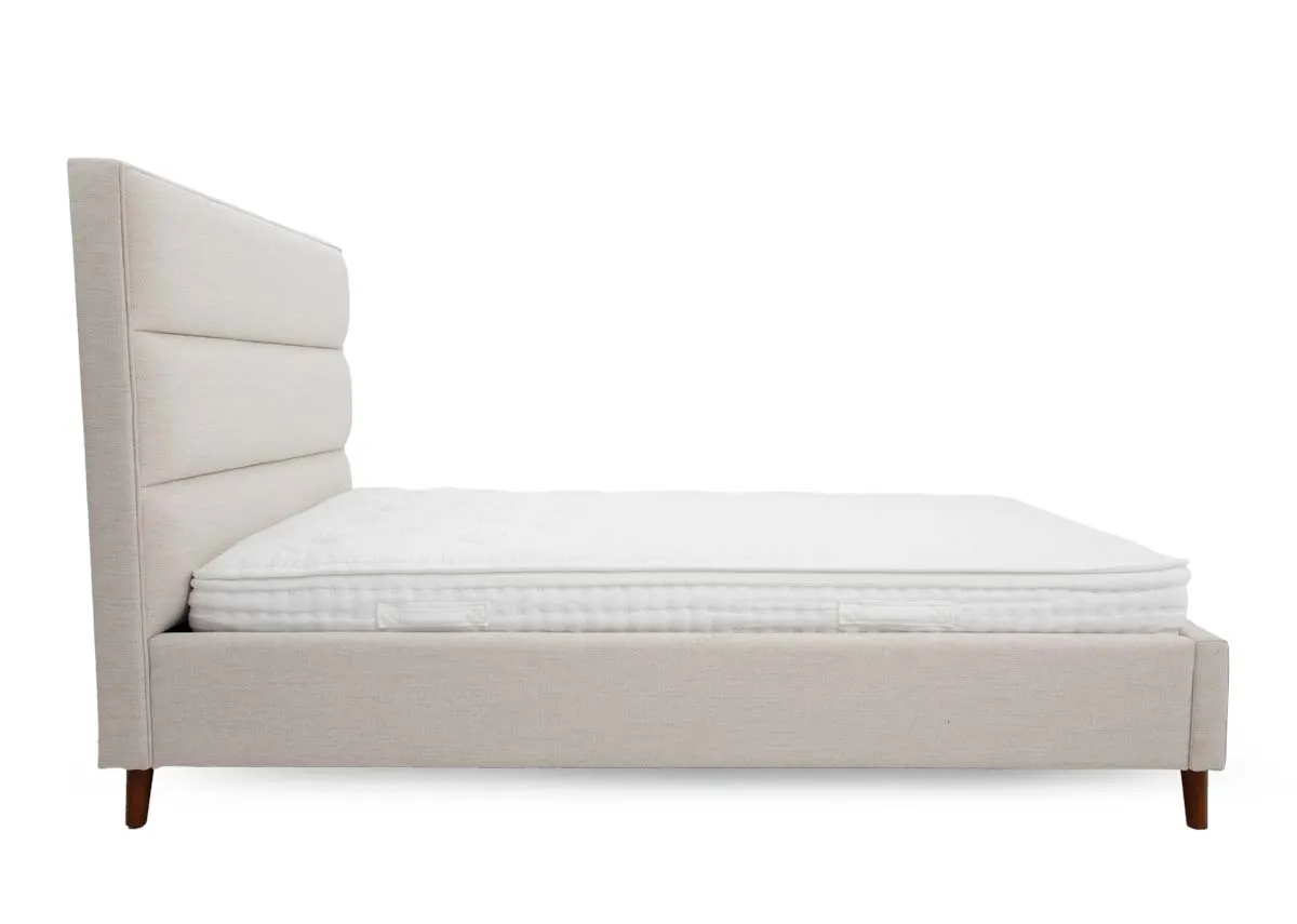 A beige fabric 4ft 6 bedframe from EZ Livings Ebony range. Side view