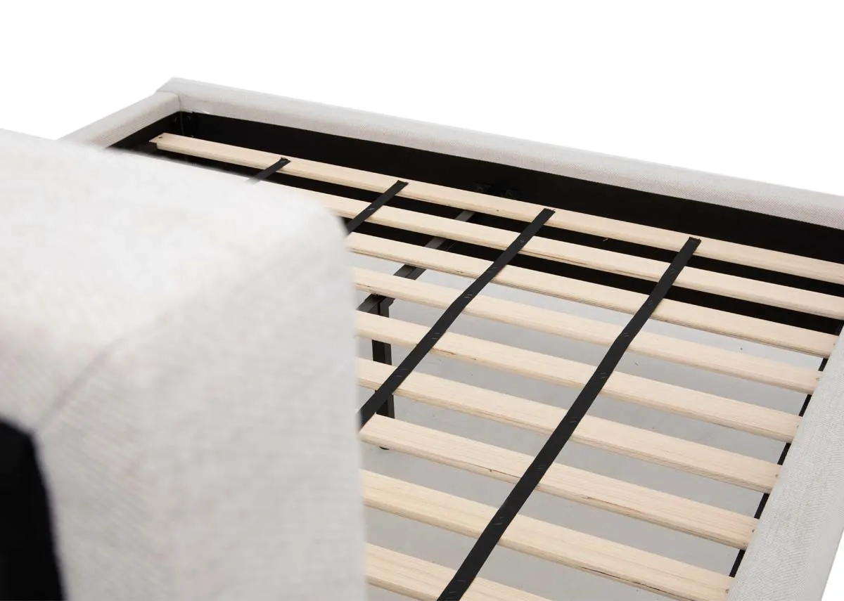A beige fabric 4ft 6 bedframe from EZ Livings Ebony range. Closeup of slat wood frame