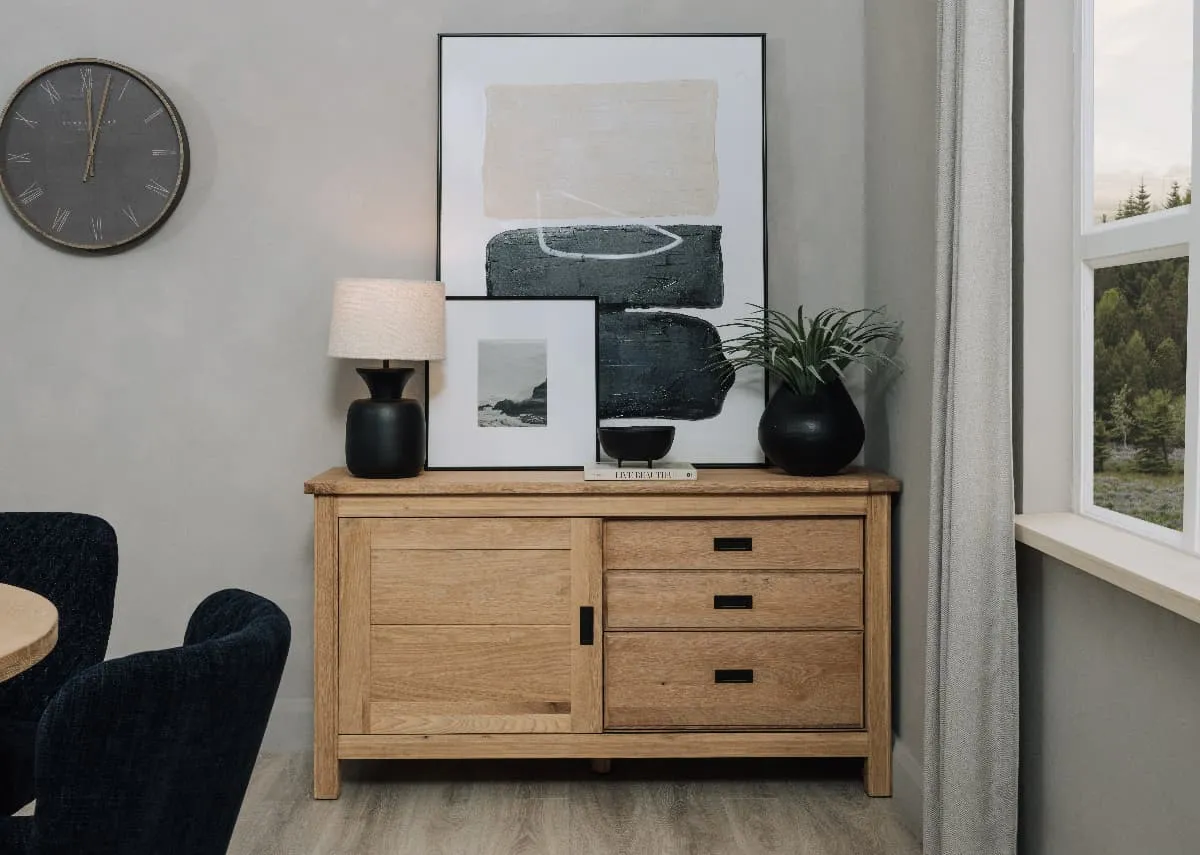 A lifestyle image of the Albany sideboard showing shelves for dishes and Mode Canvas on top.