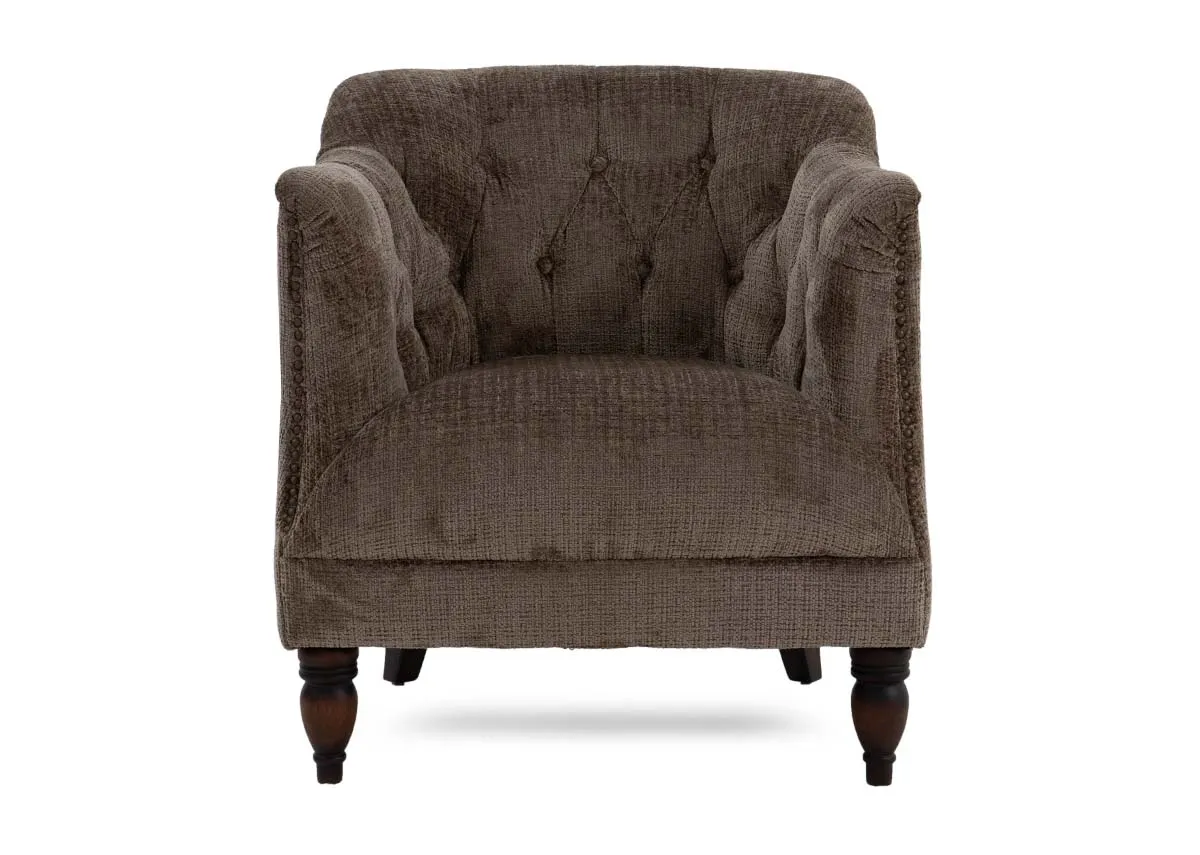 A taupe velvet fabric occasional chair from EZ Livings Carter range. Front view of column feet