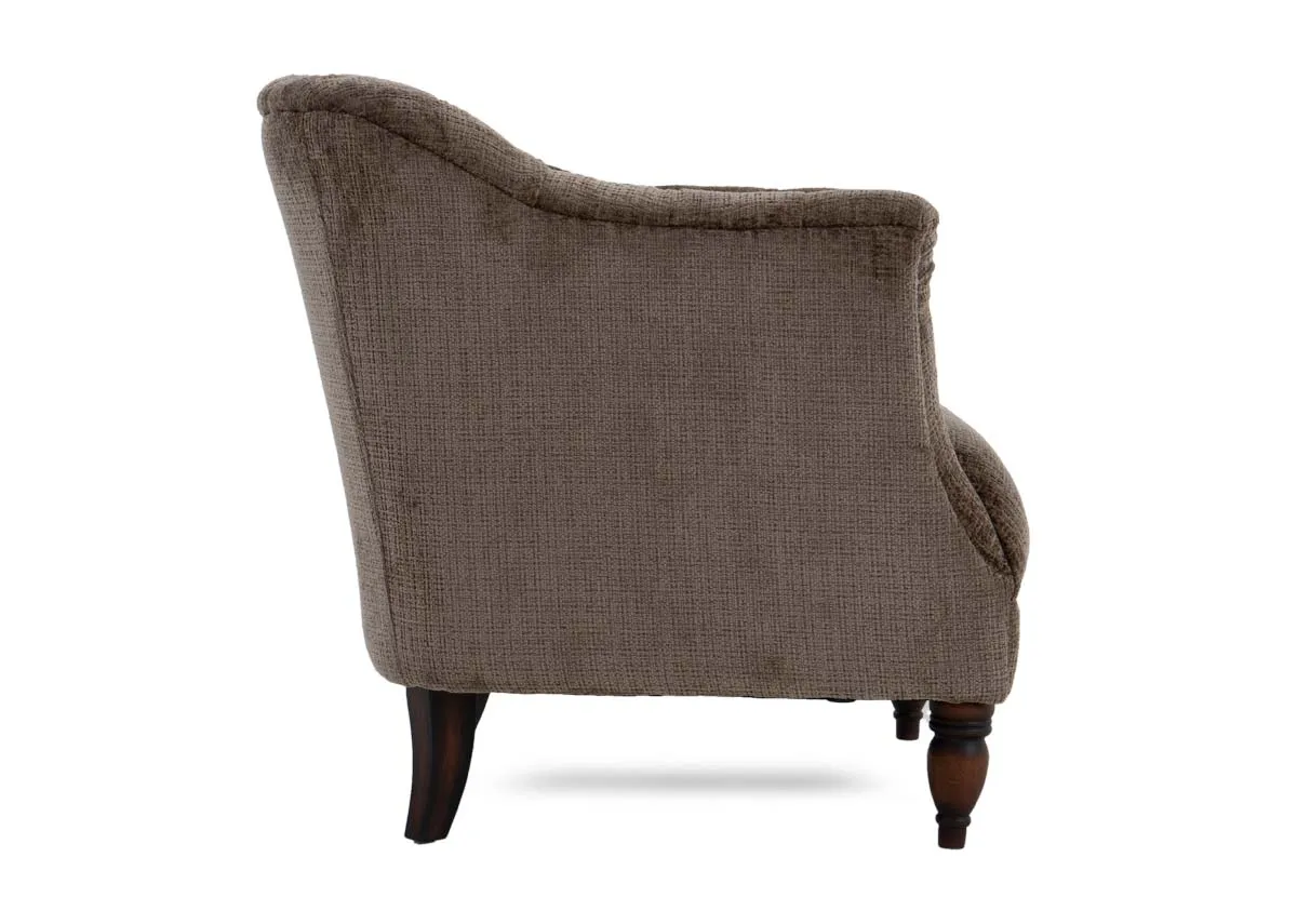 A taupe velvet fabric occasional chair from EZ Livings Carter range. Side view