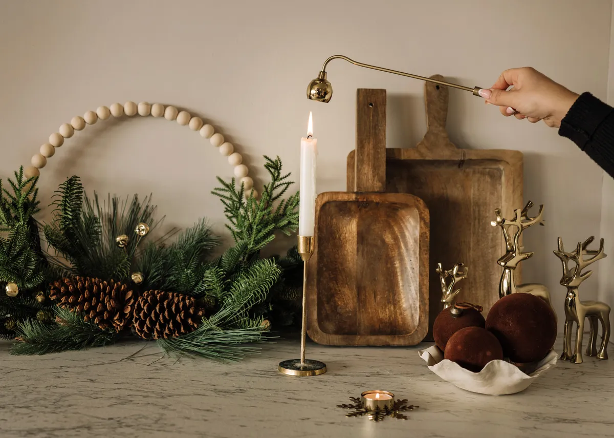 A set of 3 gold standing reindeer figurines on a shelf