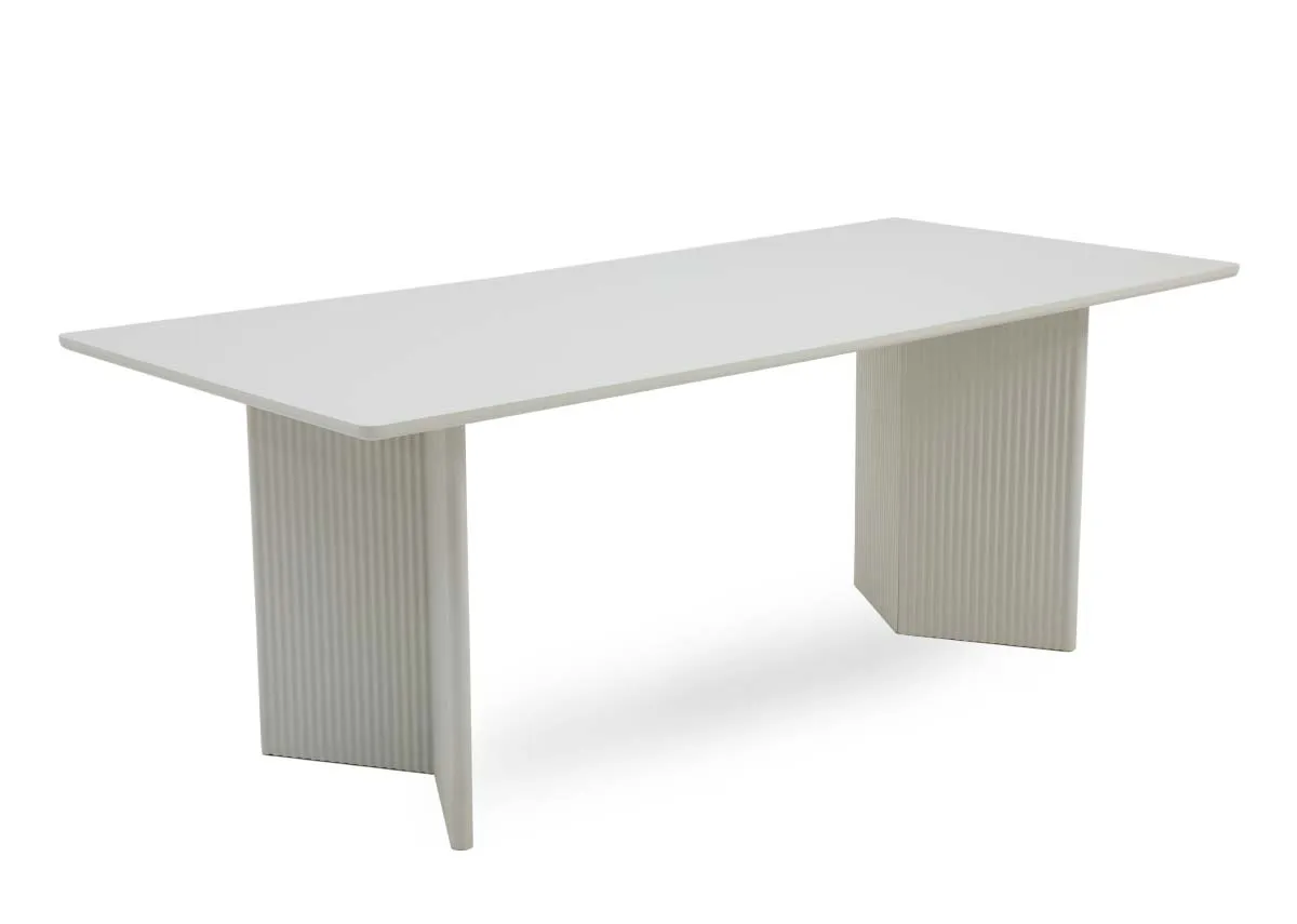 A large rectangular dining table in off white from EZ Livings Palma range. Angled view of accordian style legs
