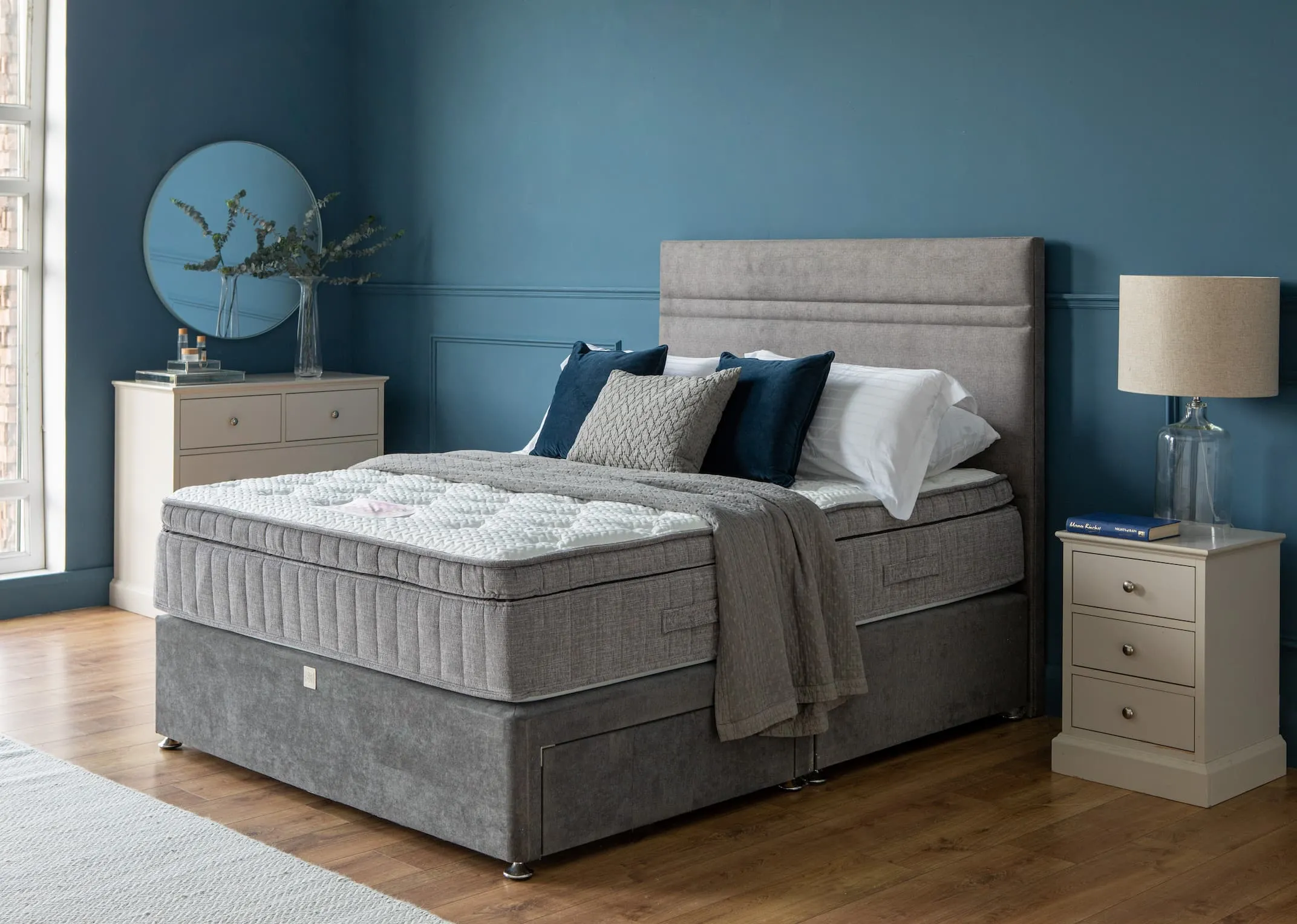 A lifestyle image of the Therma Cool 2000 on a divan bed base with brunel bedside lockers & karina lamps