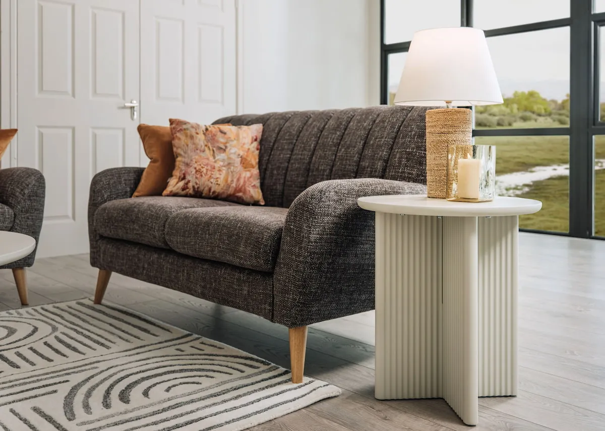 A lifestyle image of the Harper sofa with Palma table & Melody lamp.