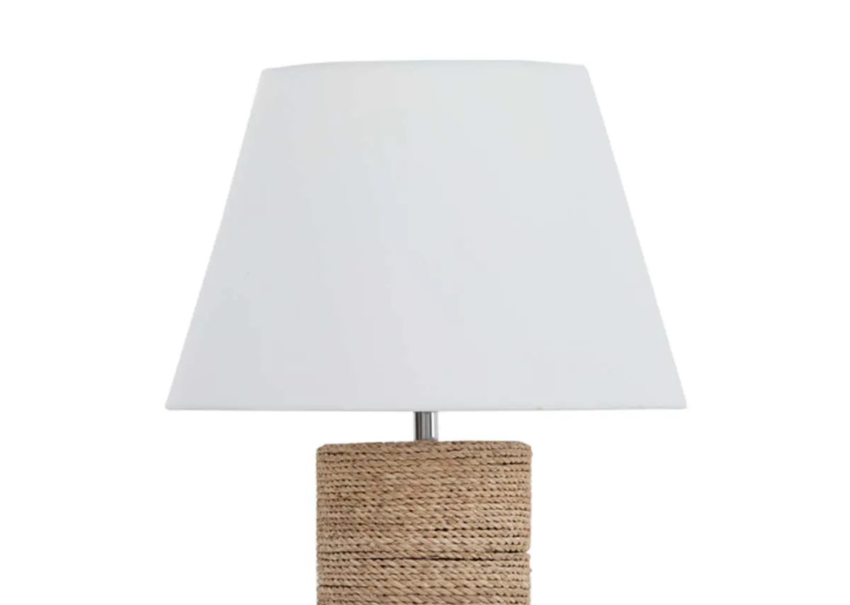A cylindrical table lamp with woven base and white shade from EZ Livings Melody range. Close up of white shade