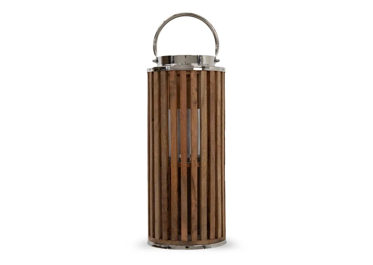 A cylindrical wooden lantern with metal handle from EZ Livings Finley range. Front view.
