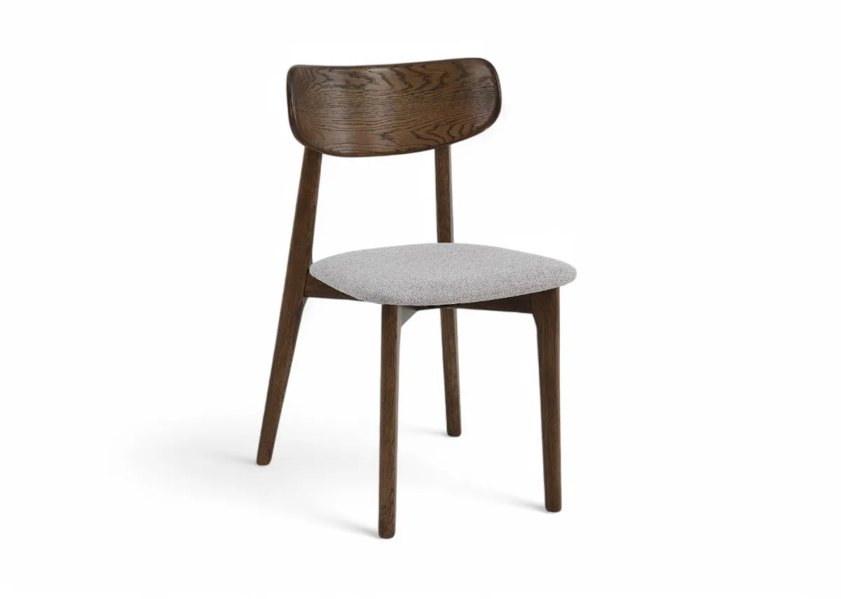A smoked oak frame dining chair with cream fabric seat from EZ Livings Bari range. Angled view