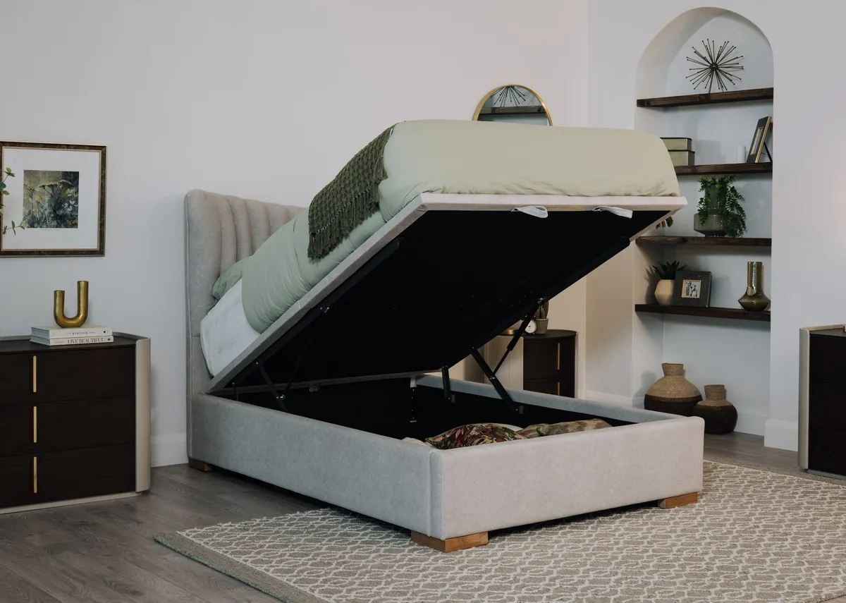A lifestyle image of the Robin grey ottoman with Canna dresser with Heiny rug.