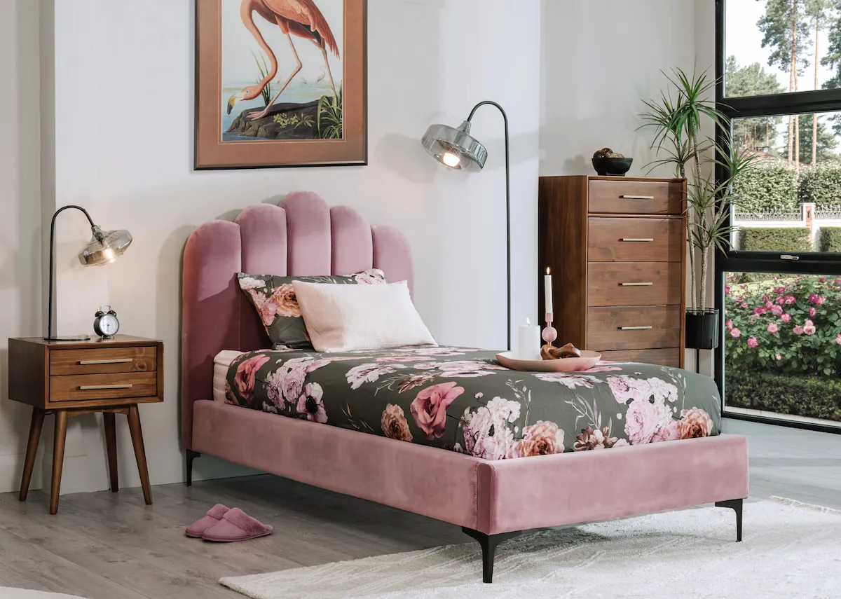 A lifestyle image of the Faye blush bed with leya locker and tallboy