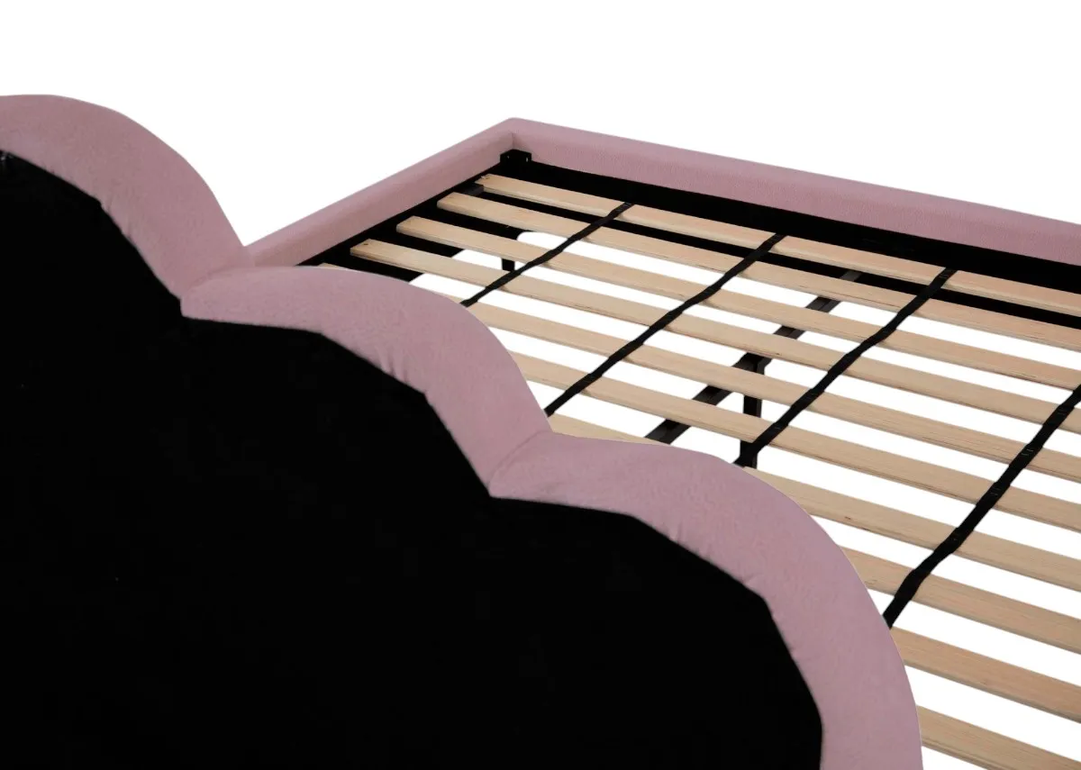 A pink bedframe with scalloped headboard from EZ Livings Fay range. Closeup of slat wood base