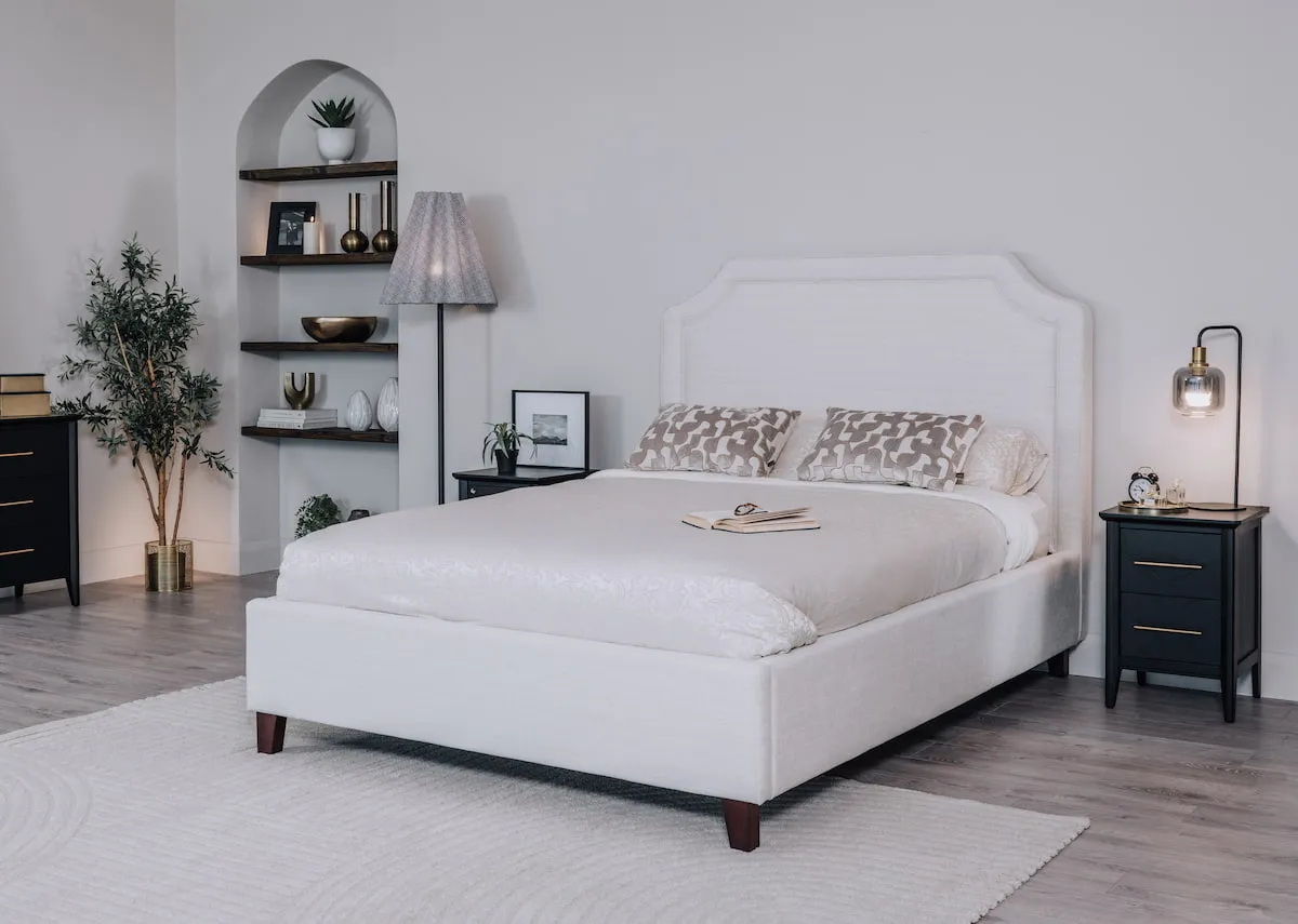 A lifestyle image of the Archie bed with chevron black locker and rodrigo lamps