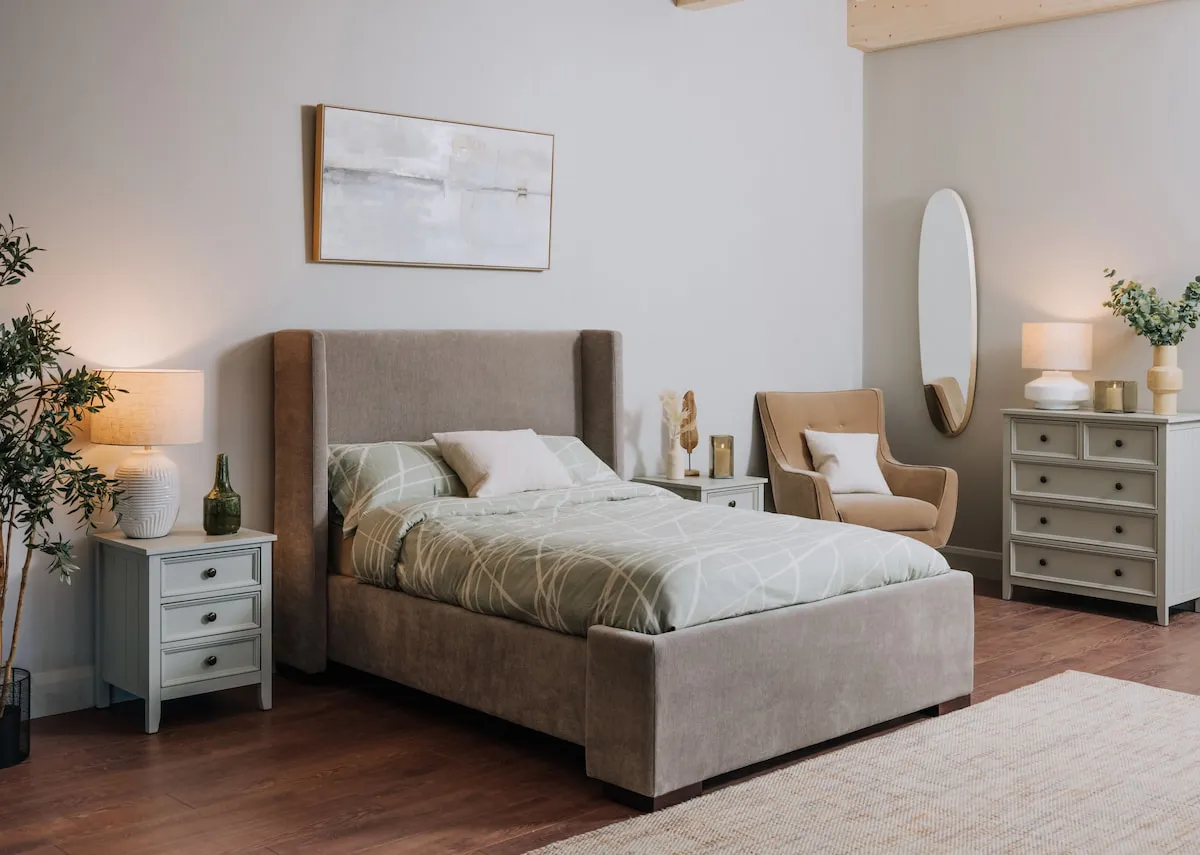 A lifestyle image of the Quaywest Bedframe with Atlas chest and lockers in green ad lakeview canvas.