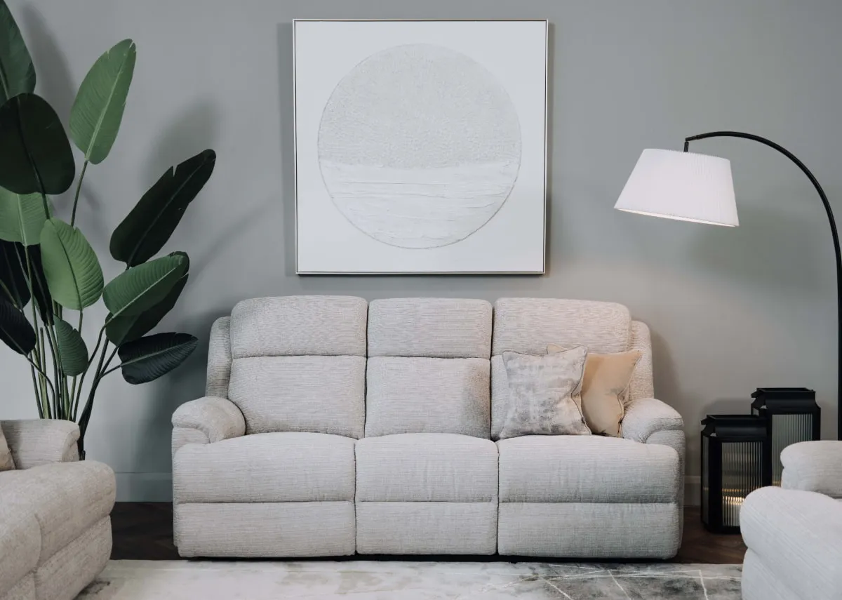 A lifestyle image of the Embrace silver 3 seater with arc lamp and pathways canvas.