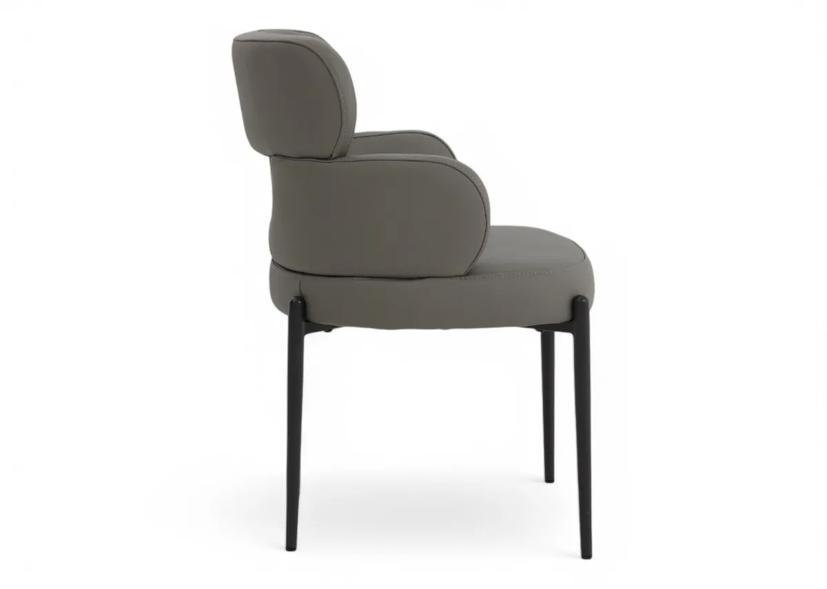 A grey leather dining chair with metal legs from EZ Livings Fusion range. Side view of curved sides