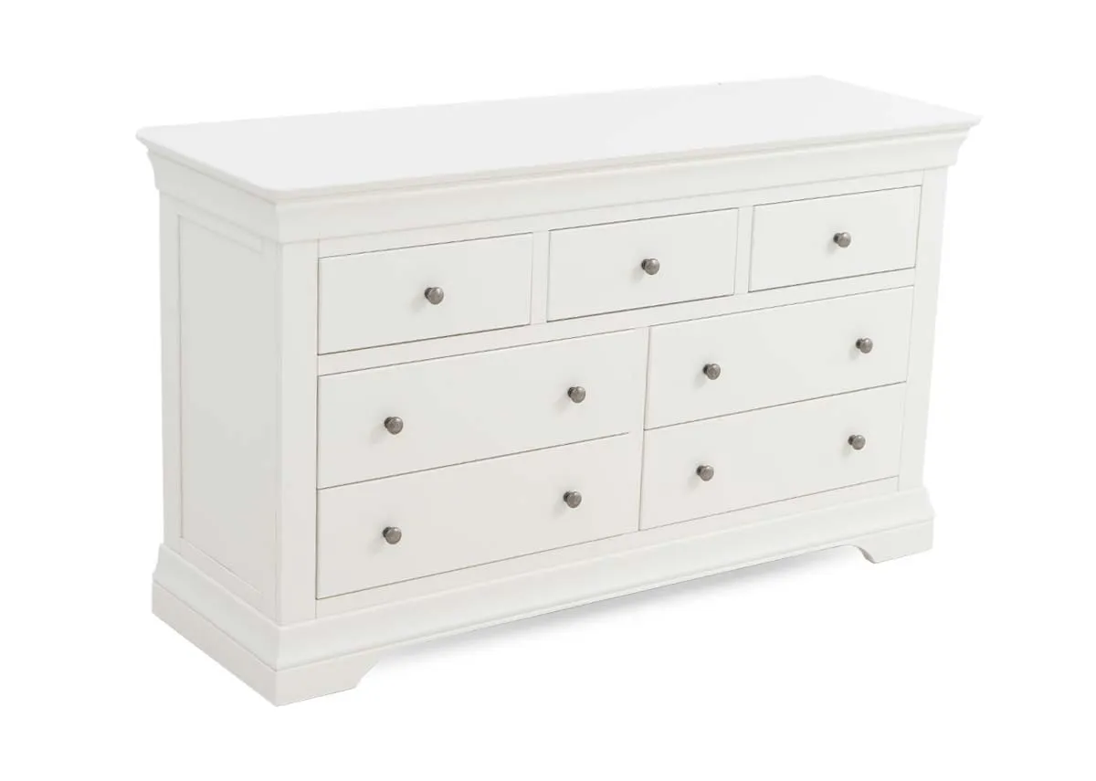 A 7 drawer dresser in white from EZ Livings Dove range. Angled view of 4 large and 3 small drawers.