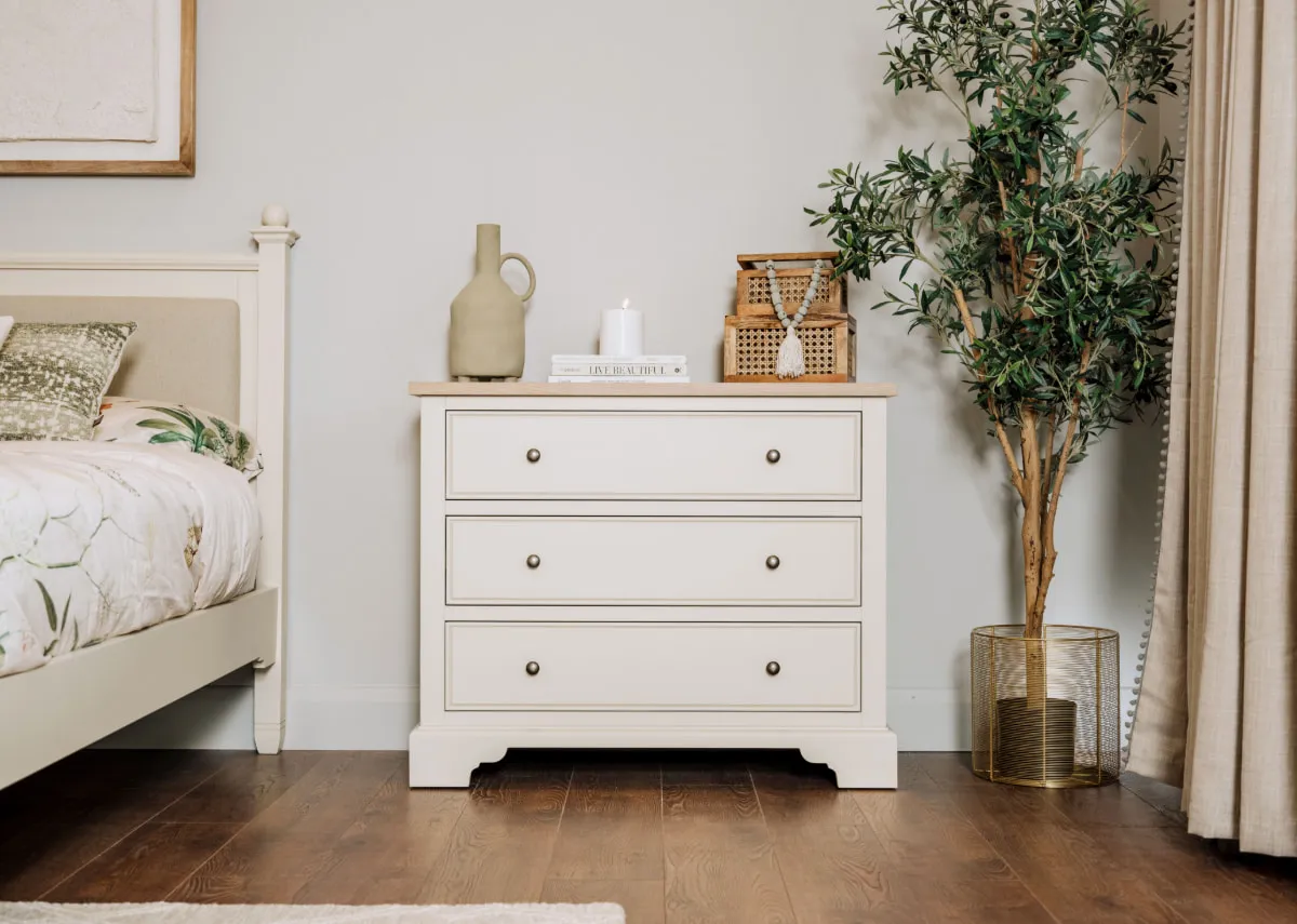 A lifestyle image of the Dawn Chest with a selection of accessories with the Olive tree