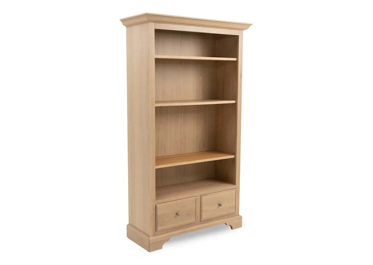 A 2 drawer oak bookcase with 4 shelves from EZ Livings Dawn range. Angled view