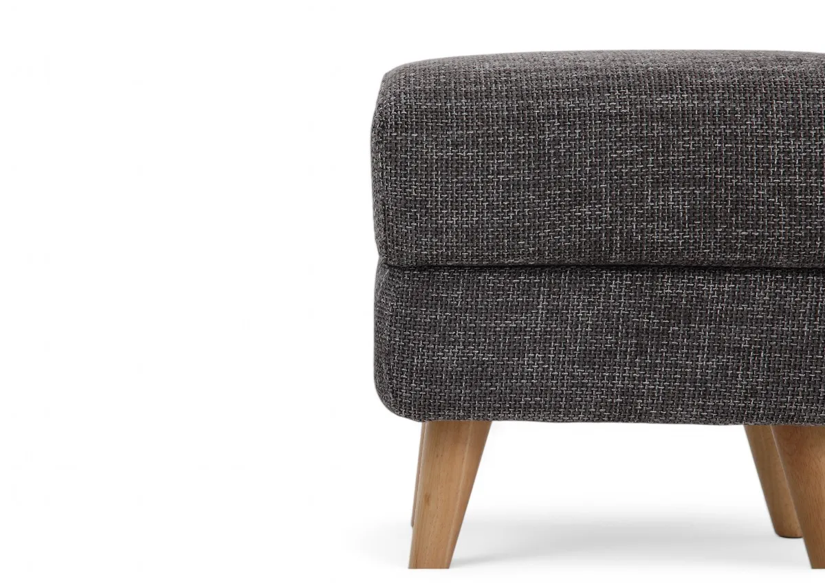 A square footstool with dark grey fabric padded seat from EZ Livings Harper range. Closeup of refined fabric