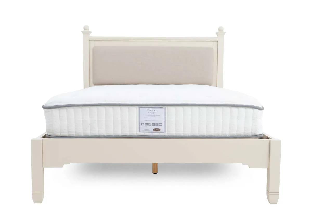 A 4ft cream bedframe from EZ Livings Dawn range. End view of headboard with fabric panel.