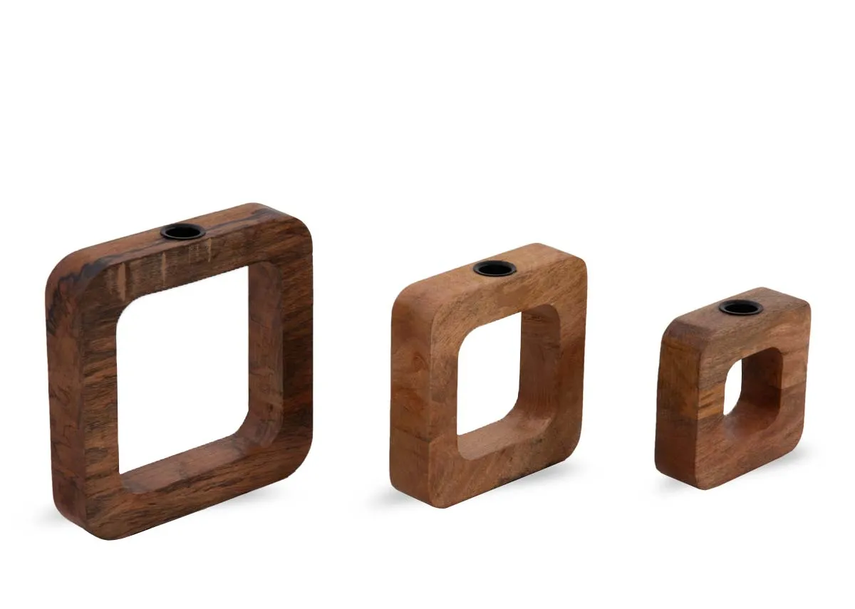A set of 3 wooden square candle holders from EZ Livings Asher range. Angled view of 3 sizes with space to put the dinner candles.