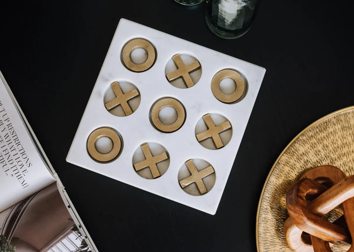 A lifestyle image of the Tik Tac Toe gamebox on a coffee table as a decorative prop