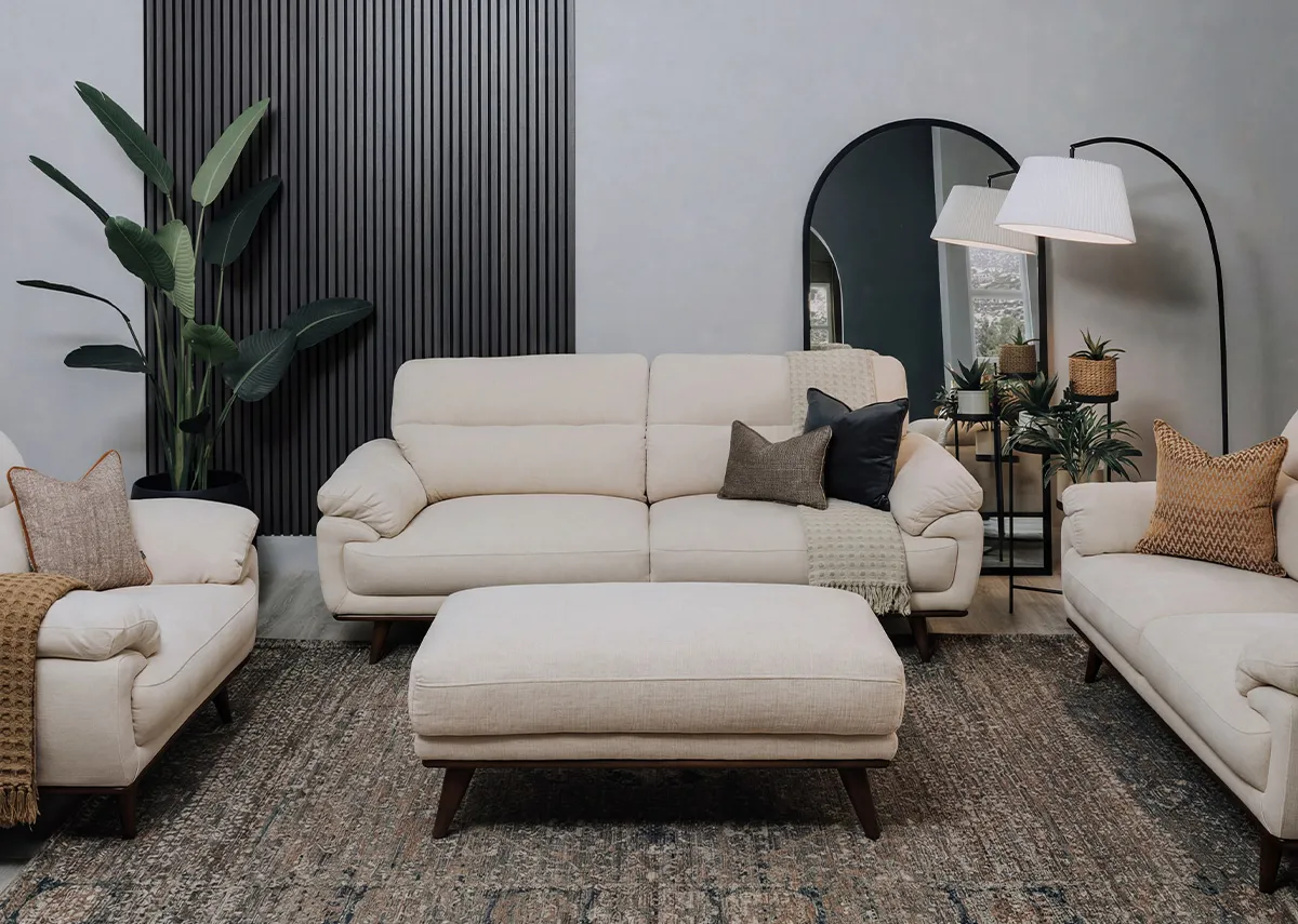 A lifestyle image of the Pippa 2 seater and 3 seater with the footstool on a Maxima rug.