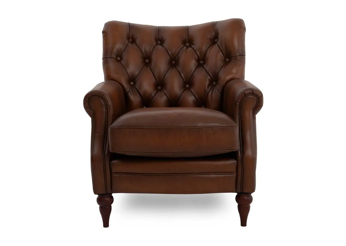 A brown leather accent chair from EZ Livings Hudson range.Front view of deep inset button back detailing