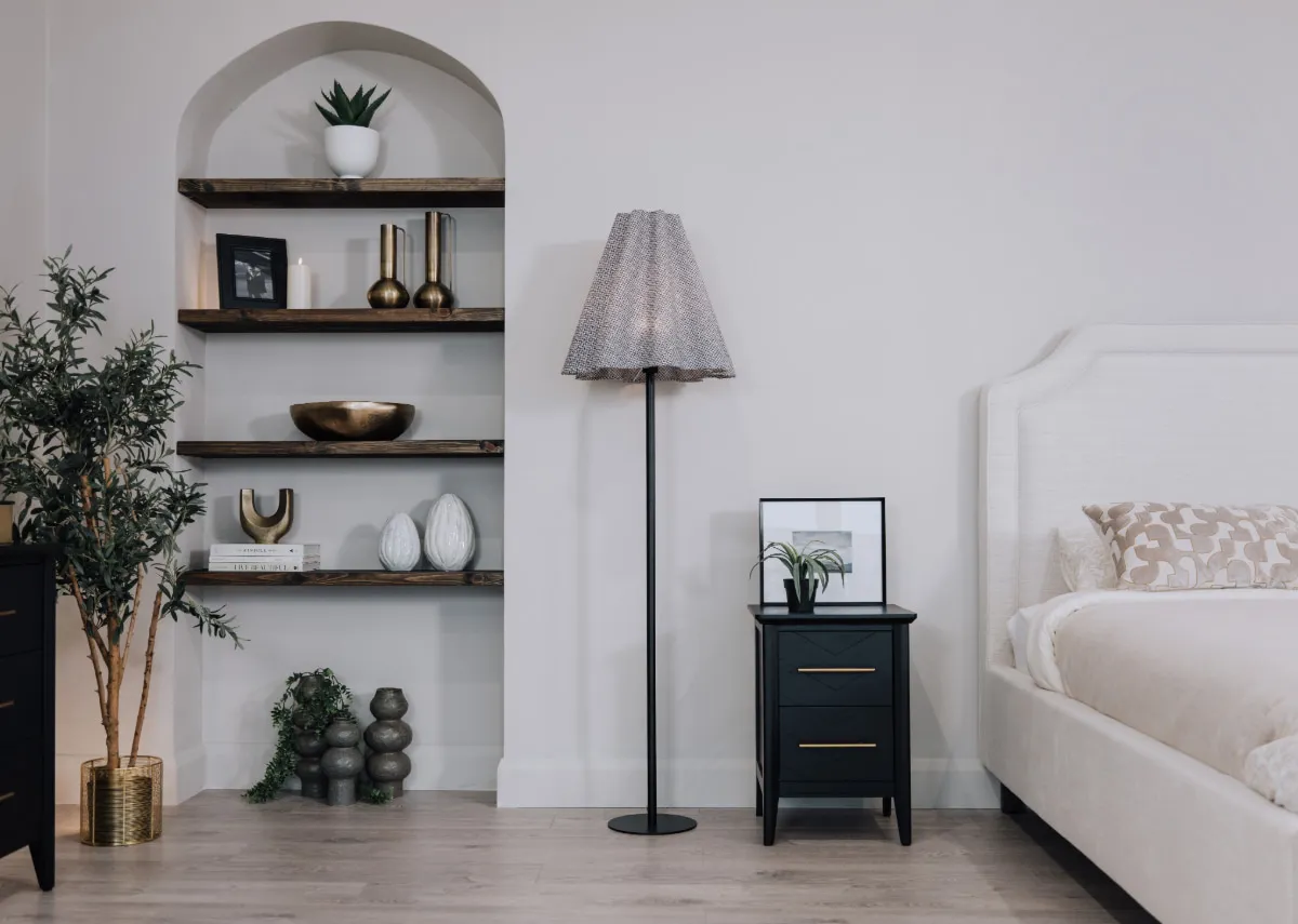 A lifestyle image of the Archie bedframe with rodrigo lamp and Rogano vases.