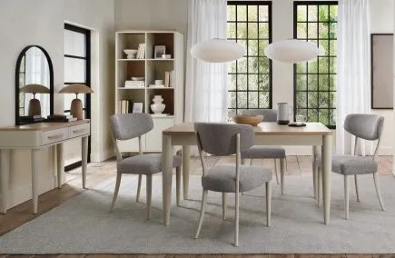 A lifestyle image of the Larsen dining table with matching chairs and console table.