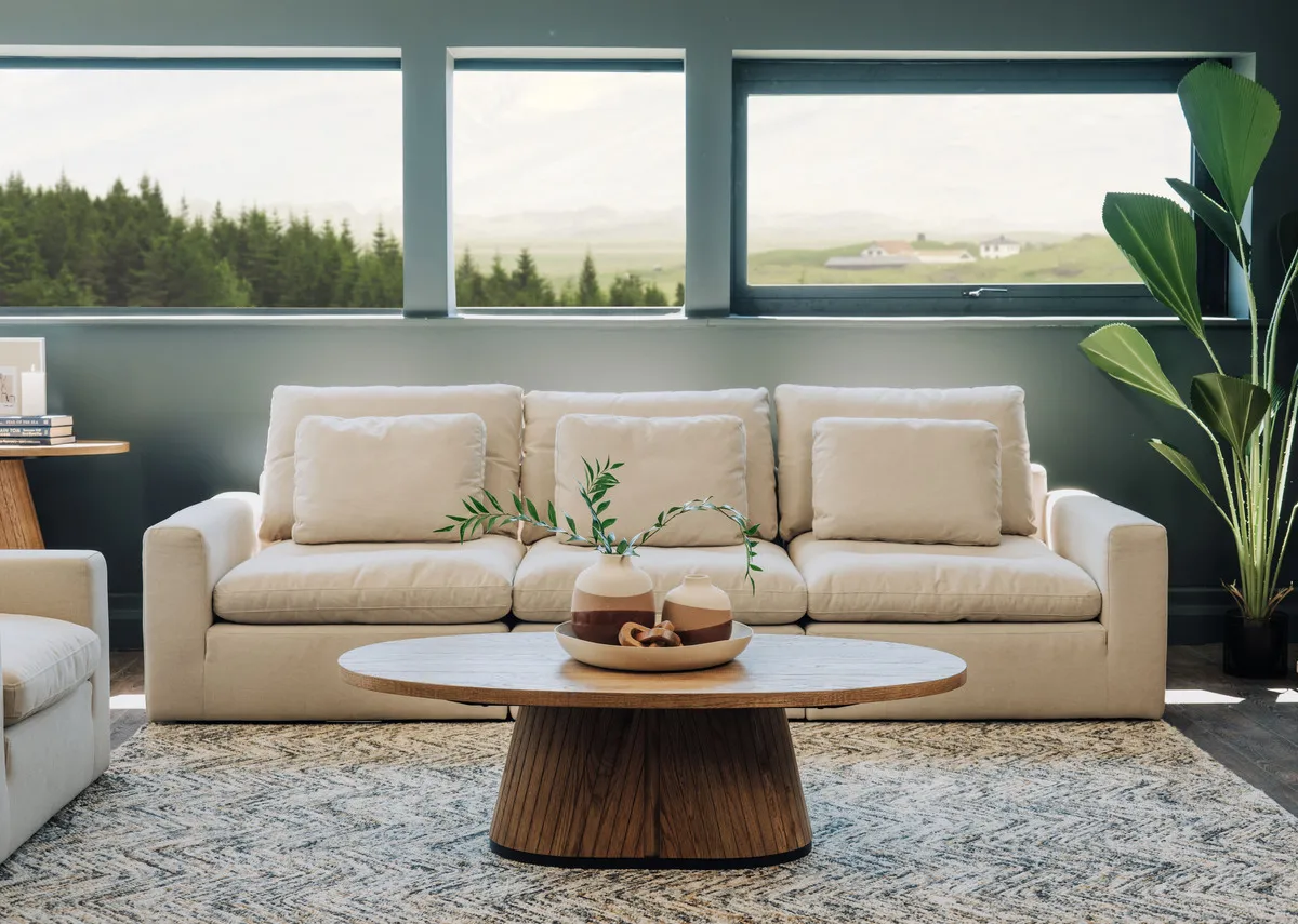A lifebstyle image of the Cozy sofa range with the Vega coffee table and san jose rug