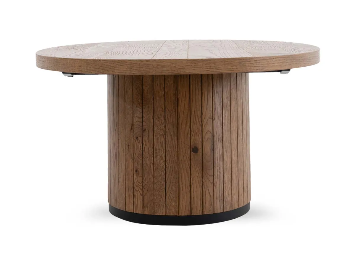An oval coffee table in rustic oak from EZ Livings Vega range. Side view of thick table top