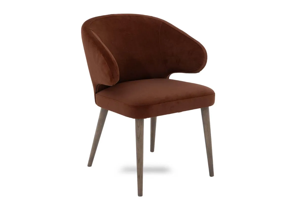 A bronze fabric dining chair from EZ Livings Victor range. Angled view of curved brace sides. and grey legs