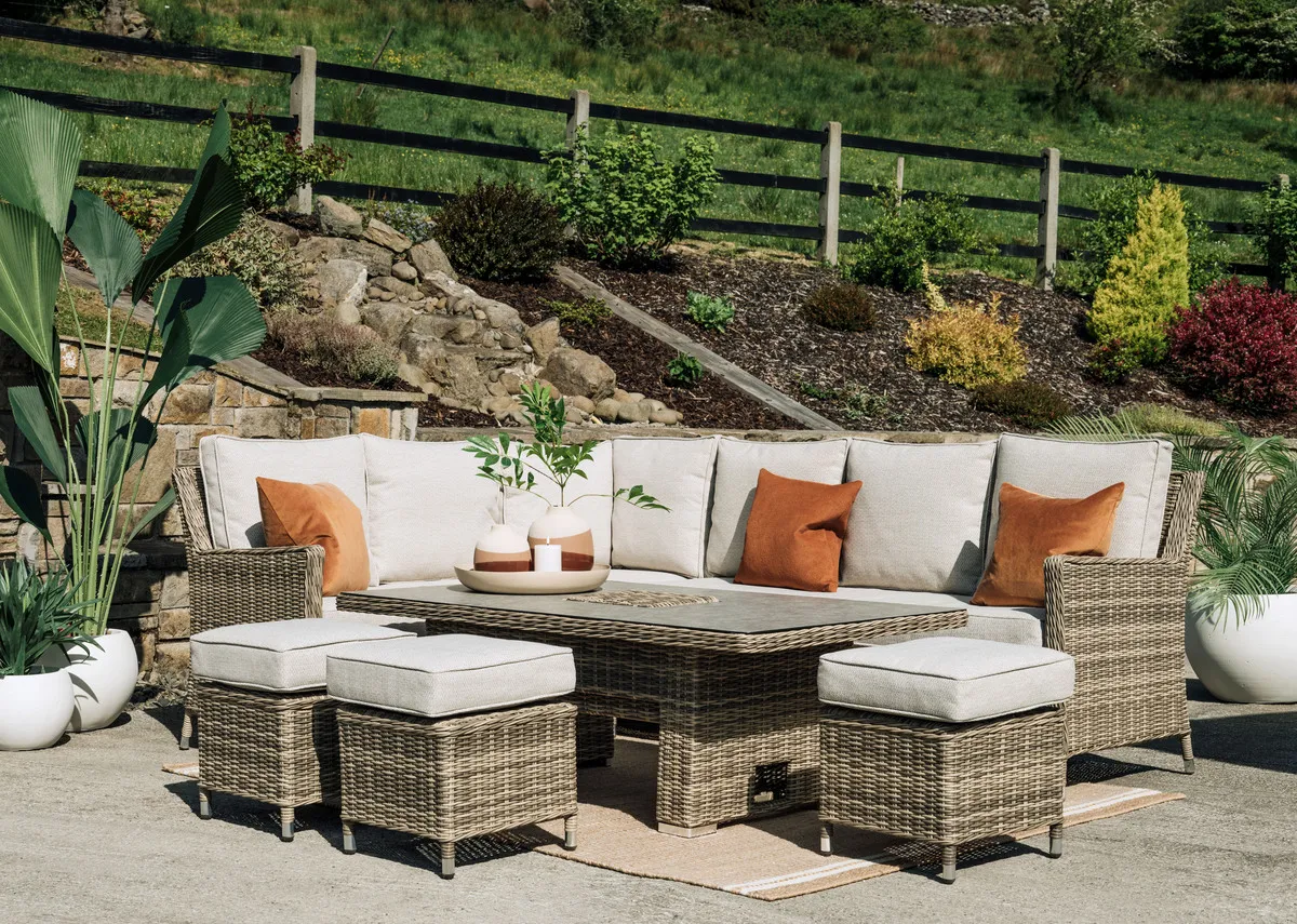 A grey woven rising table with glass top from EZ Living Furnitures Monterey range.