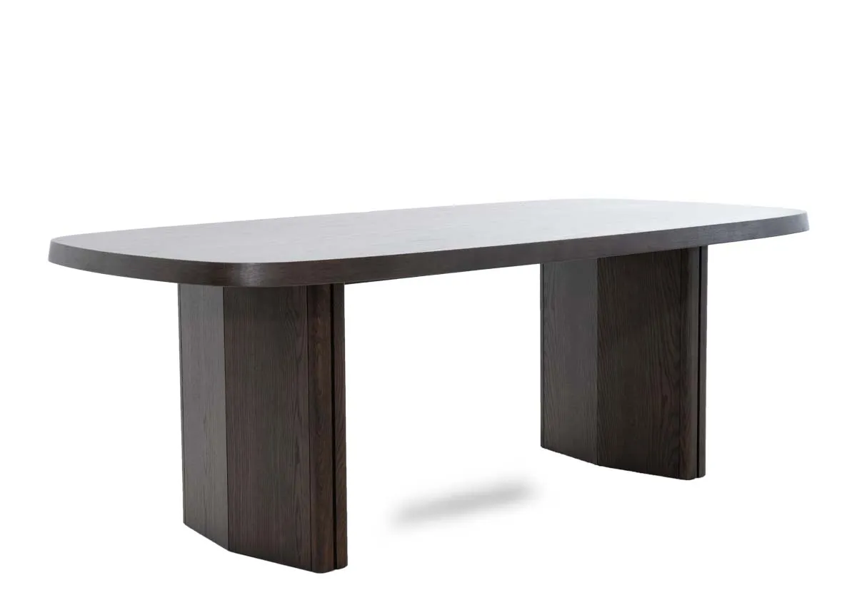 A dark brown wood dining table from EZ Livings Natu range. Angled view of chunky legs