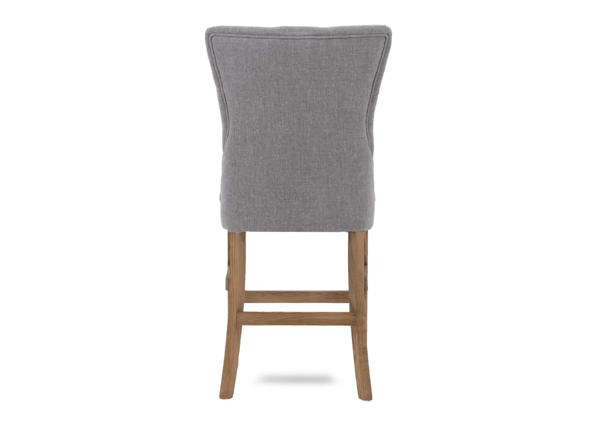 A dimension image of the grey Clara counter stool with light legs 101cm H x 52cm W x 56cm D