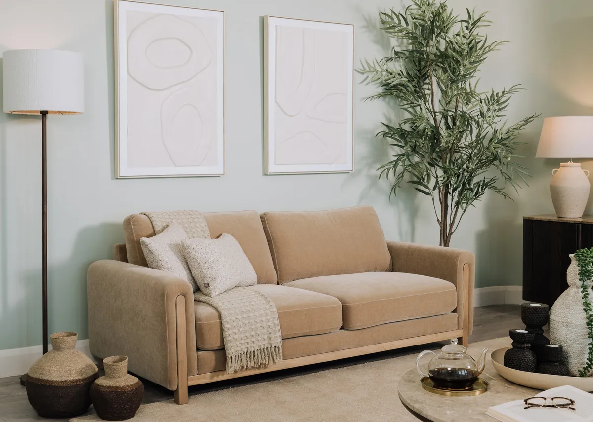 A lifestyle image of the Milelr 2 seater with the ritz coffee table and Washington lamp.