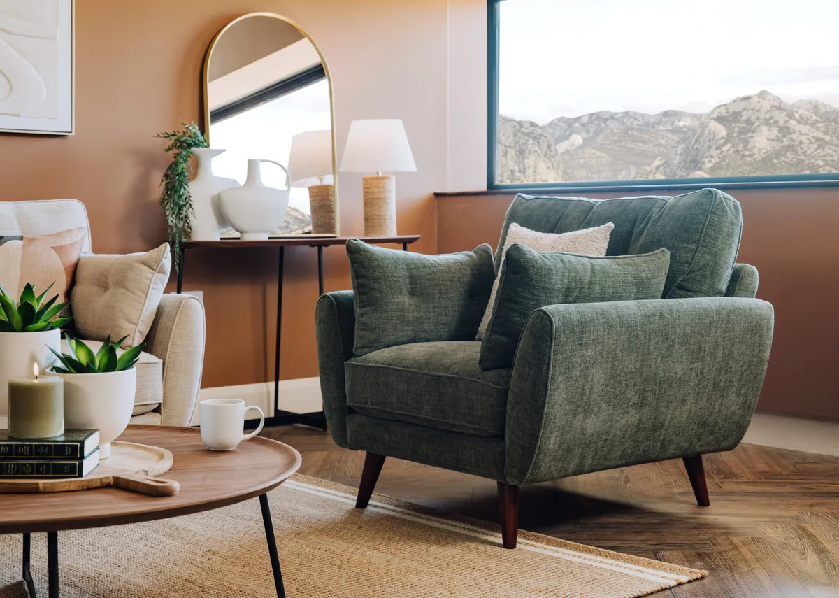 A lifestyle image of the Caoimhe armchair with Novato rug
