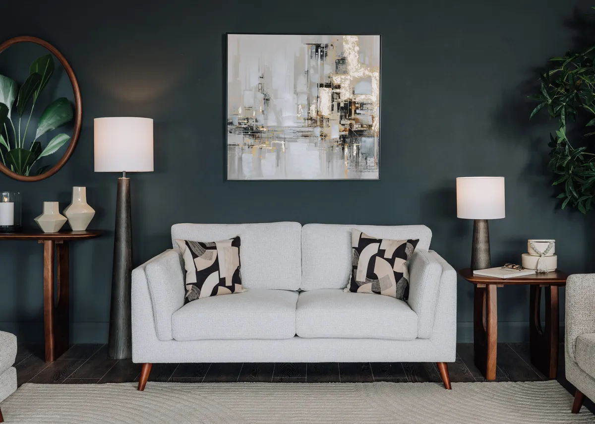 A lifestyle image of the Bailey 2 seate in grey with the Jet side and console with Tate Lamp and Liberty Canvas.