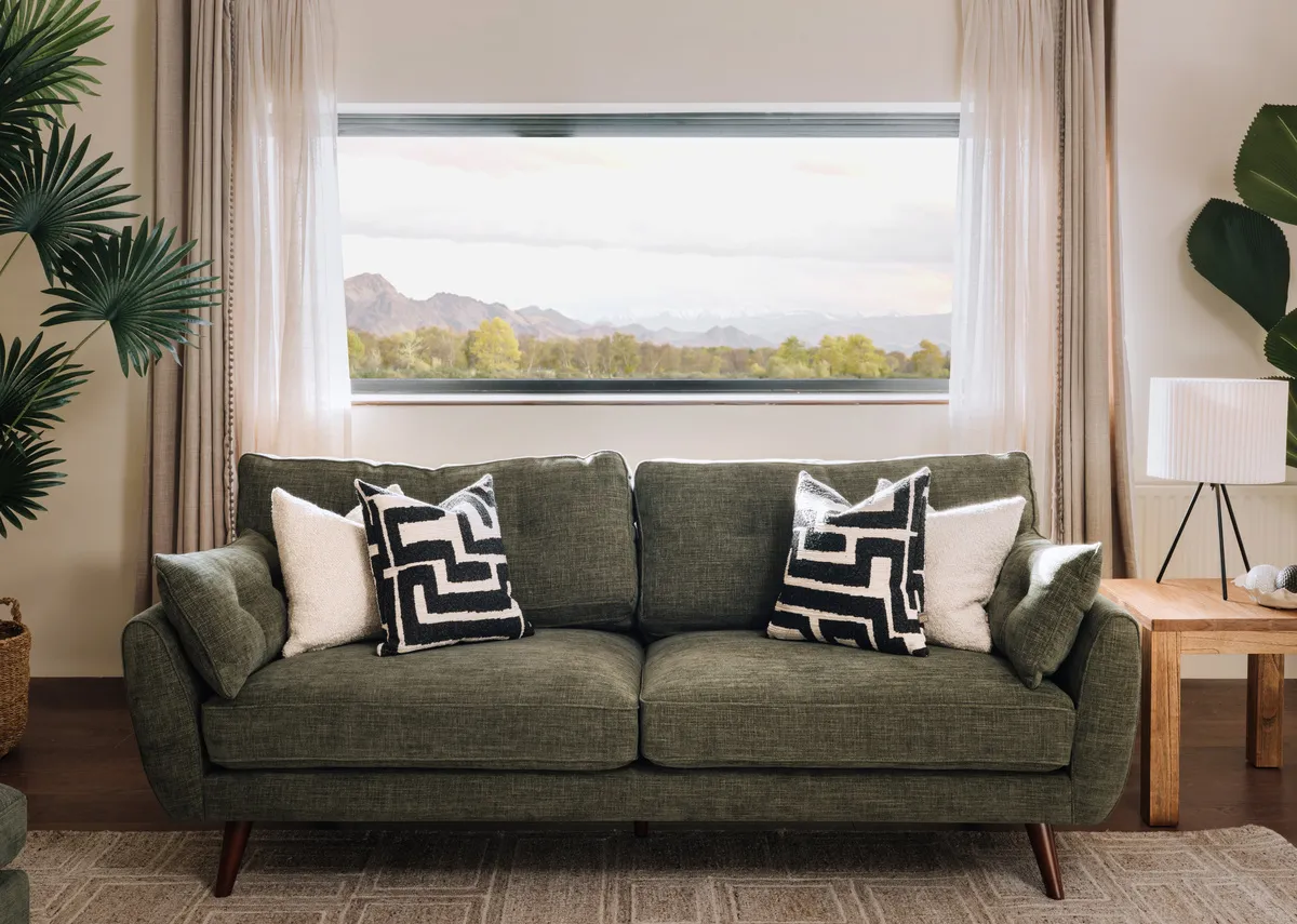A lifetsyle image of the Caoimhe green fabric sofa with Outback furniture.