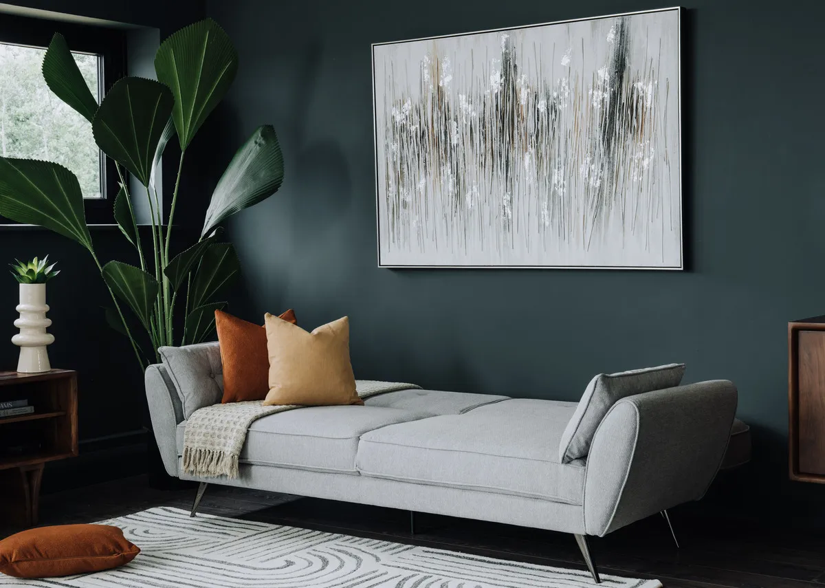 A lifestyle image of the Chloe sofa bed with seat back down and Tones of Grey print.