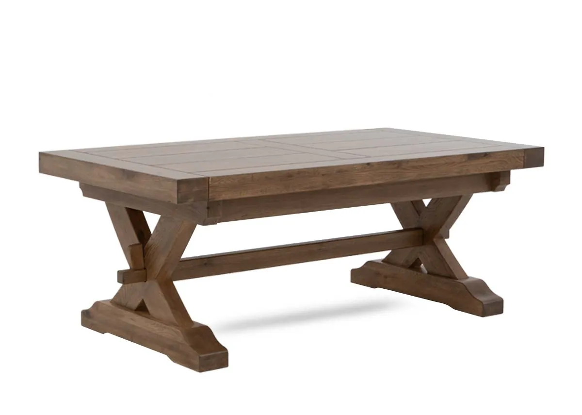 A rectangular solid oak coffee table from EZ Livings Naxos range. Angled view of trestle base.
