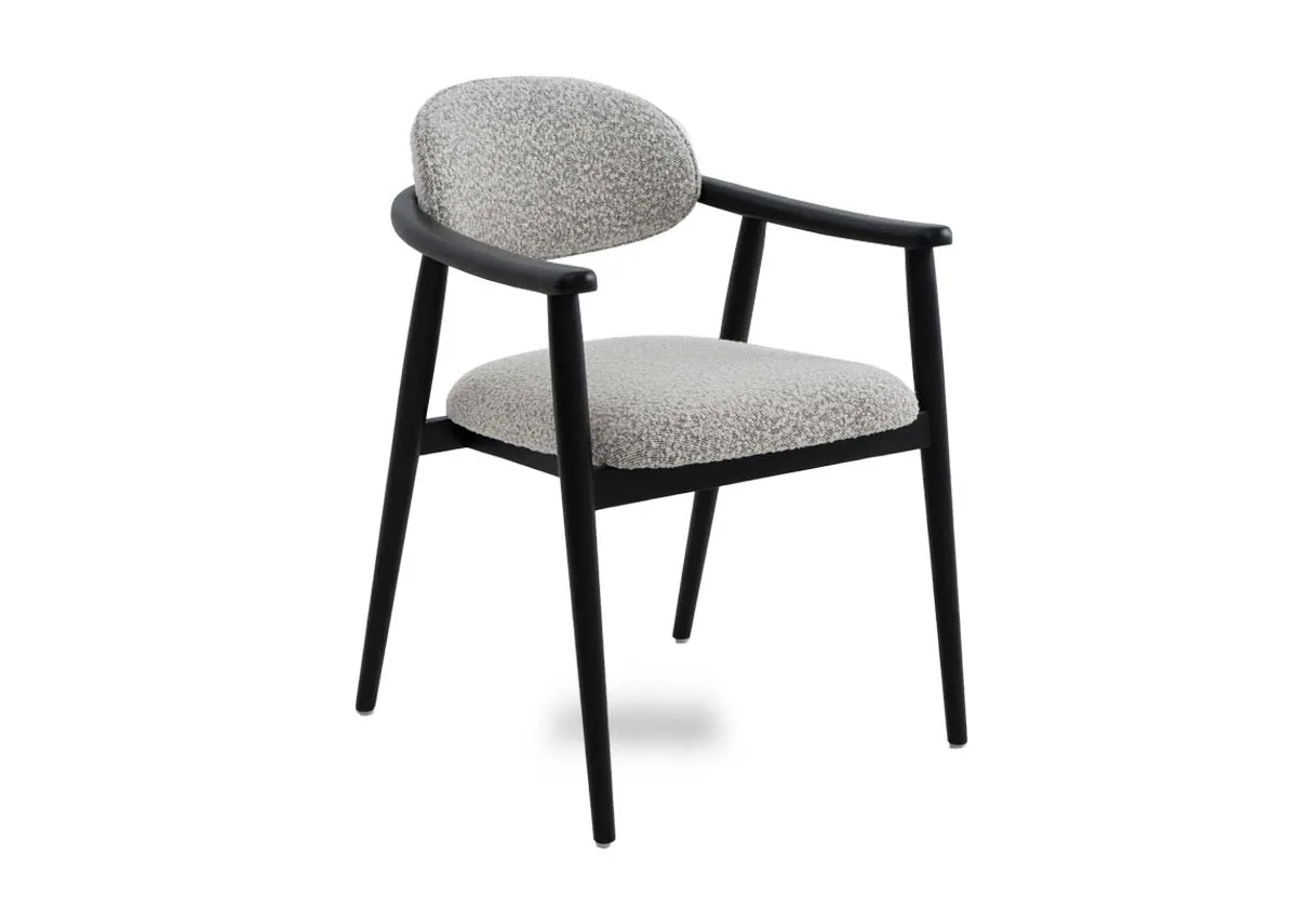 A black framed dining chair with grey boucle fabric from EZ Livings Rego range. Angled view