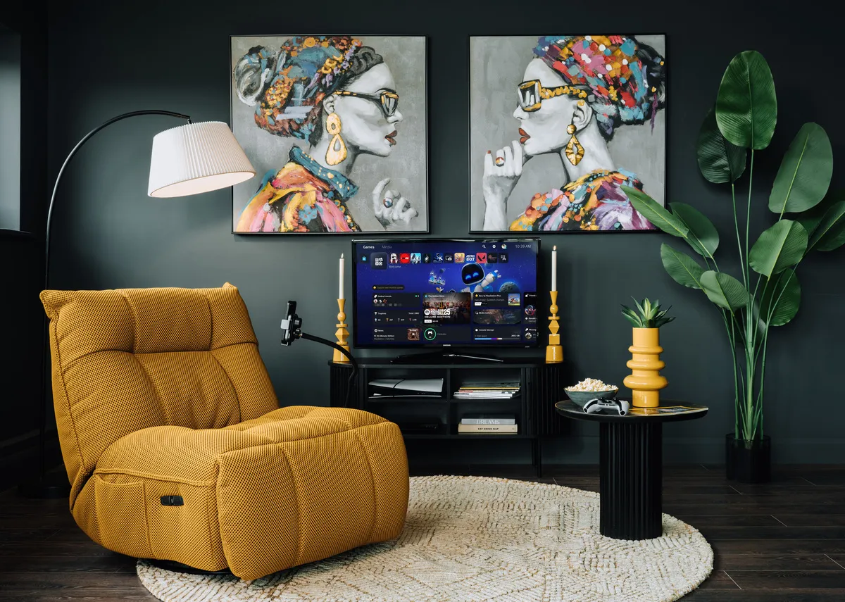 A lifestyle image of the Jave glider as an armchair with Contessa prints and Arc floor lamp.